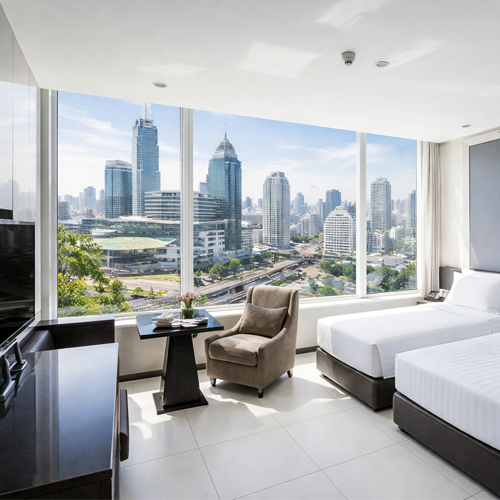 Centre Point Terminal 21 Asok Bangkok hotel room with twin beds and panoramic city skyline view